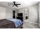 Comfortable primary bedroom with an ensuite bathroom and a large window, offering a serene retreat at 25318 N 19Th Dr, Phoenix, AZ 85085