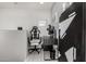 Functional home office space with a gaming chair, desk setup, and modern artwork at 25318 N 19Th Dr, Phoenix, AZ 85085