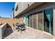 Cozy outdoor patio featuring a table with chairs and a sliding door for seamless indoor-outdoor living at 25318 N 19Th Dr, Phoenix, AZ 85085