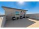 Exterior of rooftop deck featuring mountain views, string lights, and chairs with cushions at 25318 N 19Th Dr, Phoenix, AZ 85085