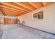 Tiled back patio with wooden-beamed cover, providing a stylish and functional outdoor living space at 2940 W Townley Ave, Phoenix, AZ 85051