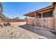 Backyard featuring a covered patio and wooden fence, providing privacy and space for outdoor enjoyment at 2940 W Townley Ave, Phoenix, AZ 85051