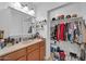 Functional bathroom with a closet, ample counter space, and updated fixtures at 2940 W Townley Ave, Phoenix, AZ 85051