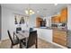 A cozy dining area features wood cabinets and tile floors with a window for natural light at 2940 W Townley Ave, Phoenix, AZ 85051
