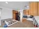 An efficient kitchen with wood cabinets, appliances, and counter space for cooking at 2940 W Townley Ave, Phoenix, AZ 85051