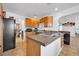 Well-lit kitchen showcases wood cabinets, gas cooktop, and granite countertops at 2940 W Townley Ave, Phoenix, AZ 85051