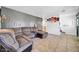 The comfortable living room features tile flooring, recessed lighting, and a textured wall at 2940 W Townley Ave, Phoenix, AZ 85051