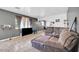 Inviting living room featuring a plush sectional sofa and open access to the dining area at 2940 W Townley Ave, Phoenix, AZ 85051