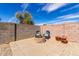 Backyard with a fire pit and chairs, surrounded by a block wall for privacy at 3426 E Elgin St, Gilbert, AZ 85295
