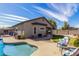 Backyard featuring a pool, covered patio, small lawn and stepping stones at 3426 E Elgin St, Gilbert, AZ 85295