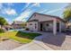 Backyard with a swimming pool, covered patio, and a well-manicured lawn with stepping stones at 3426 E Elgin St, Gilbert, AZ 85295