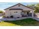 The house has a covered patio with a dining area and a small patch of grass at 3426 E Elgin St, Gilbert, AZ 85295