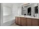 Bright bathroom featuring a double sink vanity and a large mirror at 3426 E Elgin St, Gilbert, AZ 85295