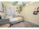 Cozy bedroom featuring a daybed, unique decor, and a playful painted ceiling at 3426 E Elgin St, Gilbert, AZ 85295