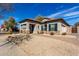 Charming single Gathering home with tile roof, stone accents, and low maintenance desert landscaping at 3426 E Elgin St, Gilbert, AZ 85295