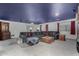 Spacious living room with blue ceiling, comfortable seating, and lots of natural light at 3426 E Elgin St, Gilbert, AZ 85295