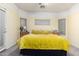 Bright main bedroom featuring large bed, side tables with lamps, and sunny windows at 3426 E Elgin St, Gilbert, AZ 85295