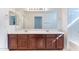 Bathroom featuring dual sinks, vanity, and large mirror at 35005 N 30Th Dr, Phoenix, AZ 85086