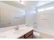 Bathroom featuring white cabinets, mirror, and tile floors at 35005 N 30Th Dr, Phoenix, AZ 85086