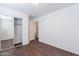 Bedroom featuring wood floors, neutral paint, and closet at 35005 N 30Th Dr, Phoenix, AZ 85086