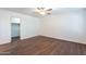 Bedroom featuring wood floors, neutral paint, and ceiling fan at 35005 N 30Th Dr, Phoenix, AZ 85086