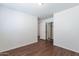 Bedroom featuring wood floors, neutral paint, and closet at 35005 N 30Th Dr, Phoenix, AZ 85086