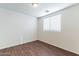 Bedroom with wood floors, a window, and neutral paint at 35005 N 30Th Dr, Phoenix, AZ 85086
