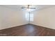Clean, unfurnished bedroom with hardwood floors, natural light, and ceiling fan at 35005 N 30Th Dr, Phoenix, AZ 85086