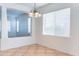 Bright dining area featuring tile floors and a stylish chandelier lighting at 35005 N 30Th Dr, Phoenix, AZ 85086