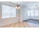 Dining area featuring tile flooring and a modern chandelier at 35005 N 30Th Dr, Phoenix, AZ 85086