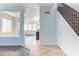 Bright entryway featuring tile flooring, a staircase, and an open view to the living spaces at 35005 N 30Th Dr, Phoenix, AZ 85086