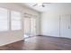 Inviting living room boasts hardwood floors, natural light, and a sliding glass door at 35005 N 30Th Dr, Phoenix, AZ 85086