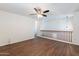 A spacious loft with a ceiling fan, wood floors, and a railing overlooking the level below at 35005 N 30Th Dr, Phoenix, AZ 85086