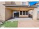 Covered patio area offers a shady outdoor living space, complemented by easy-to-maintain artificial turf at 35005 N 30Th Dr, Phoenix, AZ 85086