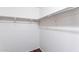 Spacious walk-in closet with bar for hanging and neutral walls at 35005 N 30Th Dr, Phoenix, AZ 85086