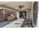 Relaxing covered patio area with an outdoor grill and ceiling fan at 4091 S Dew Drop Ct, Gilbert, AZ 85297