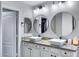Bathroom featuring granite counters, double sinks, and modern fixtures at 4091 S Dew Drop Ct, Gilbert, AZ 85297