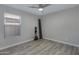 Empty bedroom featuring hardwood floors, a window, and neutral walls at 4091 S Dew Drop Ct, Gilbert, AZ 85297