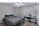 Bedroom featuring a ceiling fan, a piano, and a window with blinds at 4091 S Dew Drop Ct, Gilbert, AZ 85297