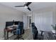 Bright bedroom features wood flooring, modern ceiling fan, and double-door closet at 4091 S Dew Drop Ct, Gilbert, AZ 85297