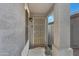 Covered front porch with a secure screen door and a welcome mat at 4091 S Dew Drop Ct, Gilbert, AZ 85297