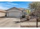 Charming single-story home featuring a well-maintained front yard and a two-car garage at 4091 S Dew Drop Ct, Gilbert, AZ 85297