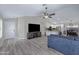 Spacious living room featuring an open floor plan with a view of the modern kitchen and a neutral color palette at 4091 S Dew Drop Ct, Gilbert, AZ 85297