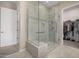 Modern bathroom features a walk-in glass shower with tile surround at 41553 W Springtime Rd, Maricopa, AZ 85138