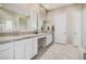 Bathroom vanity featuring granite countertops, double sinks, and a decorative tiled backsplash at 41553 W Springtime Rd, Maricopa, AZ 85138