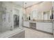 Bathroom featuring double sinks, vanity area, and frameless glass shower at 41553 W Springtime Rd, Maricopa, AZ 85138