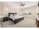Bedroom with a large window for ample natural light and ceiling fan at 41553 W Springtime Rd, Maricopa, AZ 85138