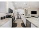Spacious kitchen with stainless steel appliances, granite countertops, and modern wood-look flooring at 41553 W Springtime Rd, Maricopa, AZ 85138