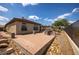 This backyard features desert landscaping, paved seating areas, fire pit, and mature desert vegetation at 41607 N Club Pointe Dr, Phoenix, AZ 85086