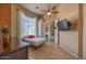 Cozy bedroom with a twin bed, mounted TV, and view to entryway at 41607 N Club Pointe Dr, Phoenix, AZ 85086